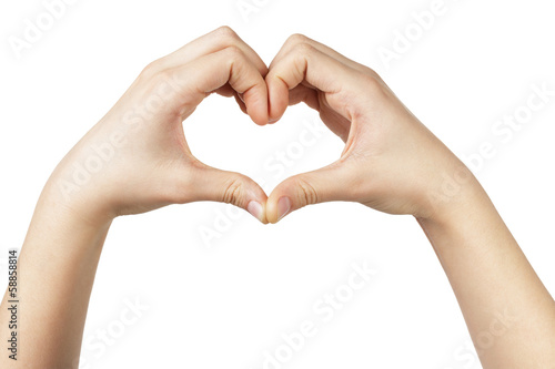 female teen hand makes heart shape with hands