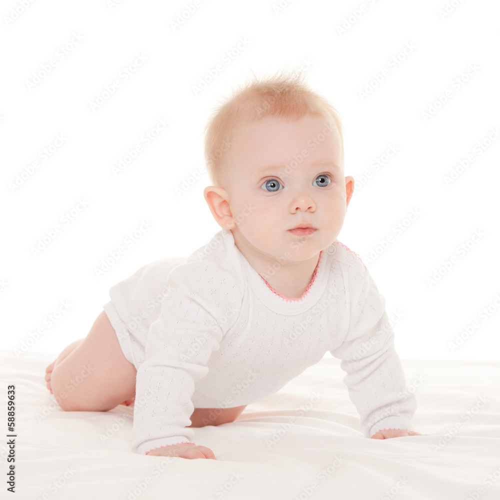 Cute baby with beautiful blue eyes on the white bed Cute baby with beautiful blue eyes on the white bed