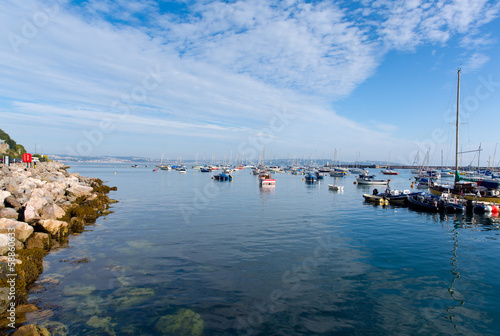 Boats by the yacht club Brixham harbour Devon England UK photo