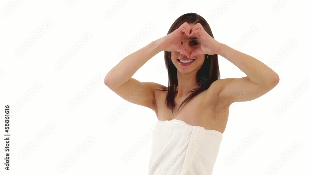 brunette young woman forming a heart with her hands brunette young woman forming a heart with her hands