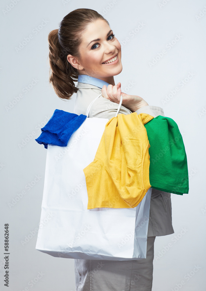 Business woman hold white shopping bag turned back. Business woman hold white shopping bag turned back.