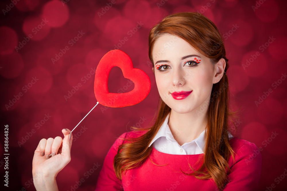 Redhead girl with shape heart toy. Redhead girl with shape heart toy.