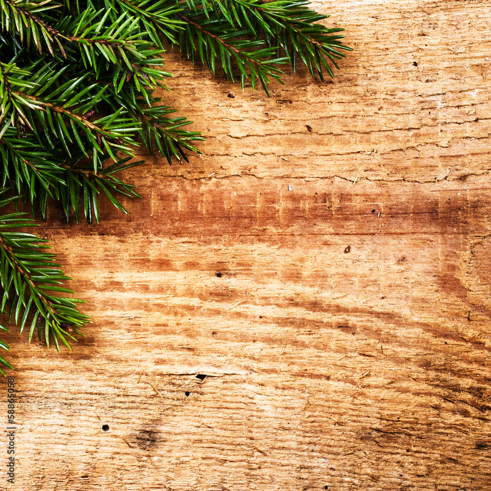 Christmas Background with Fir Tree Branch on wooden background w Christmas Background with Fir Tree Branch on wooden background w