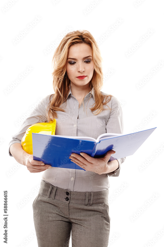 Woman engineer looking on files and holding a helmet Woman engineer looking on files and holding a helmet
