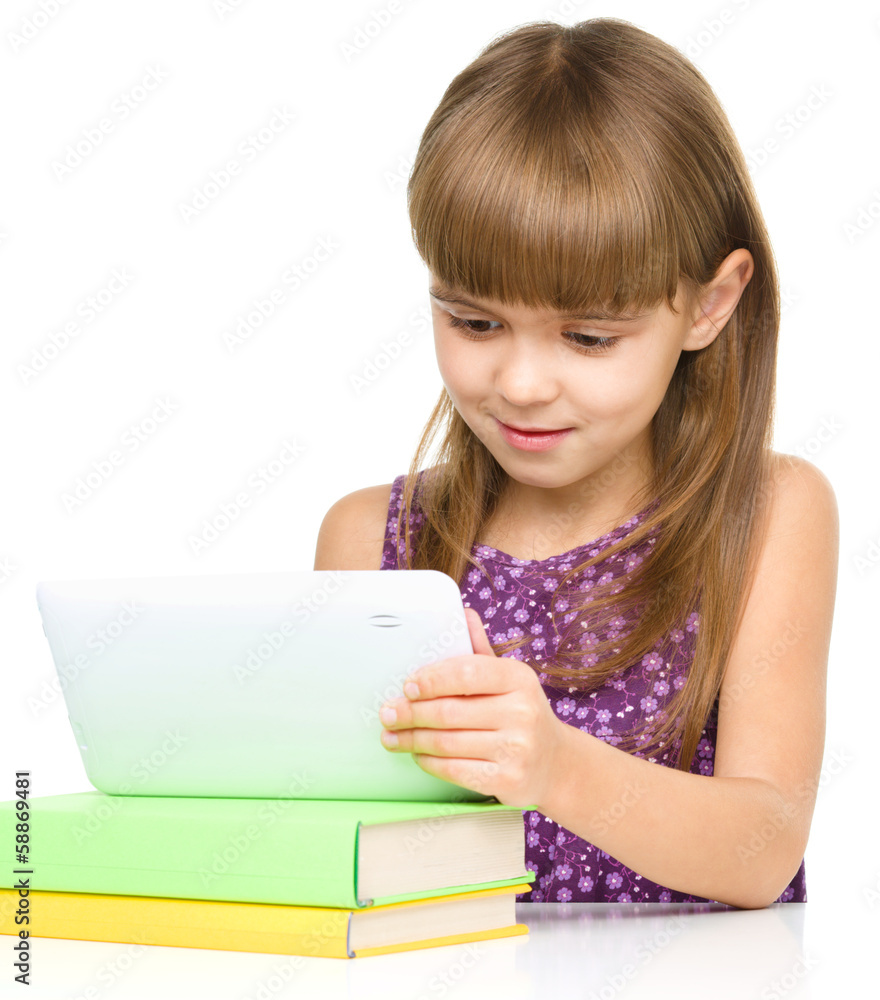 Young girl is using tablet Young girl is using tablet
