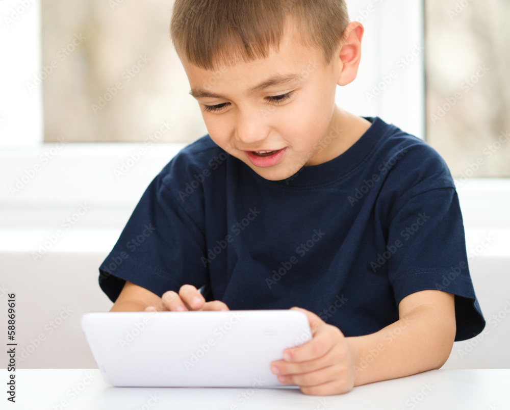 Young boy is using tablet Young boy is using tablet