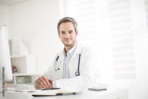 young doctor at his office