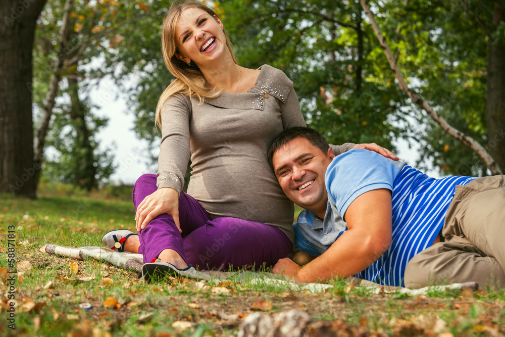 Portrait happy smiling couple of future parents Portrait happy smiling couple of future parents