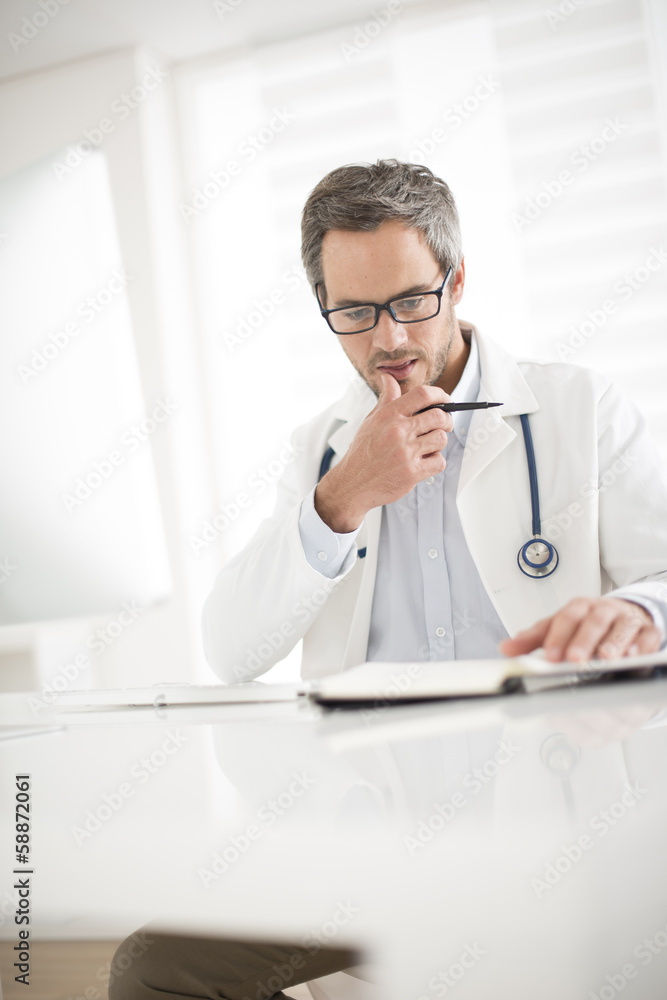 young doctor at his office young doctor at his office