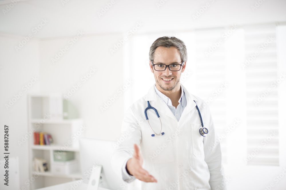 young doctor welcoming at his office young doctor welcoming at his office