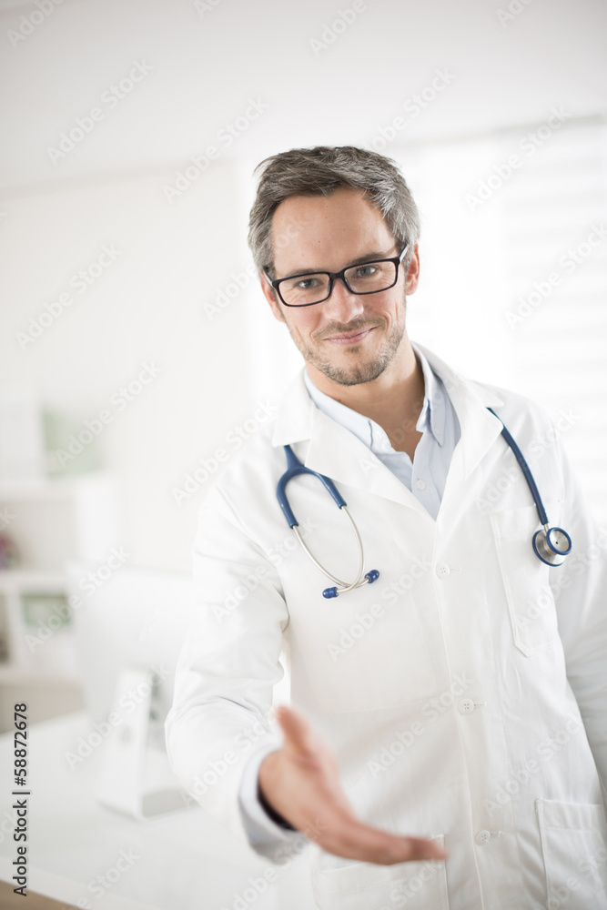 young doctor welcoming at his office young doctor welcoming at his office