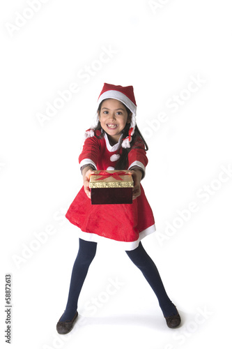 Cute Little Girl in Santa Claus costume holding a Christmas Box
