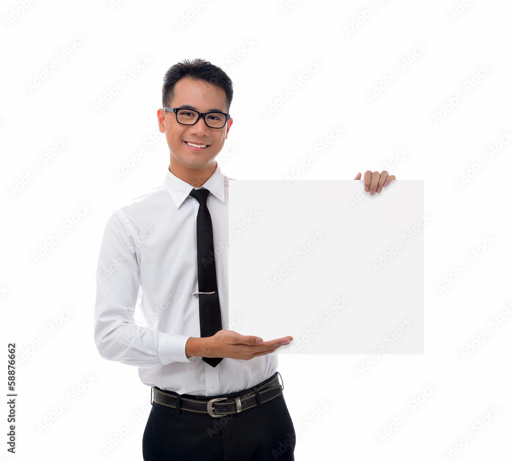 Young businessman holding blank billboard Young businessman holding blank billboard