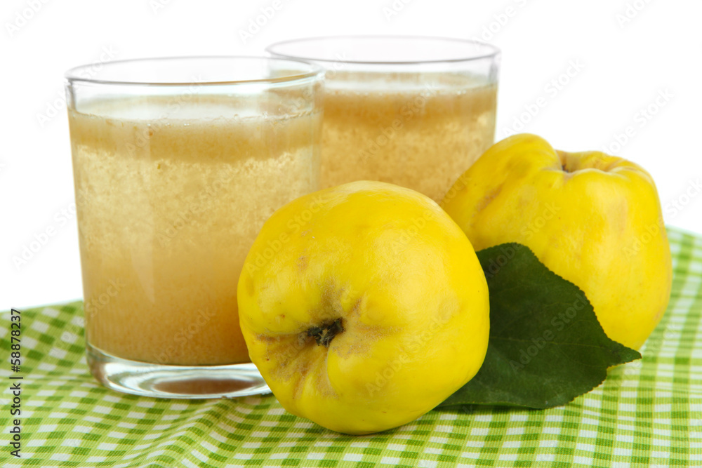 Sweet quince with juice on table on white background Sweet quince with juice on table on white background