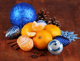 Christmas tangerines and Christmas toys on wooden table