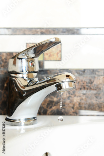 Ceramic sink with chrome fixture  close up