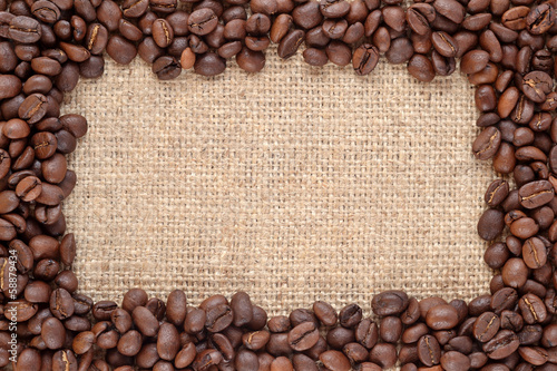 Frame of coffee beans in a sacking background
