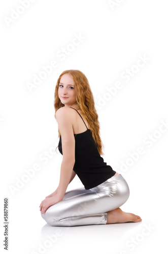 Young redhead girl in tight leggings