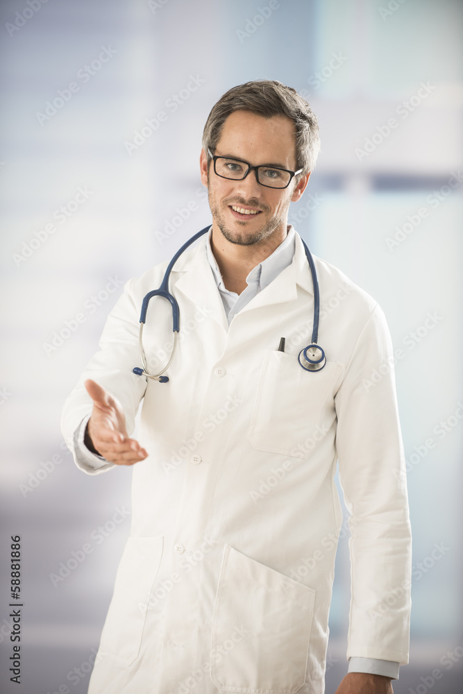 doctor holding out his hand as a sign of hospitality doctor holding out his hand as a sign of hospitality