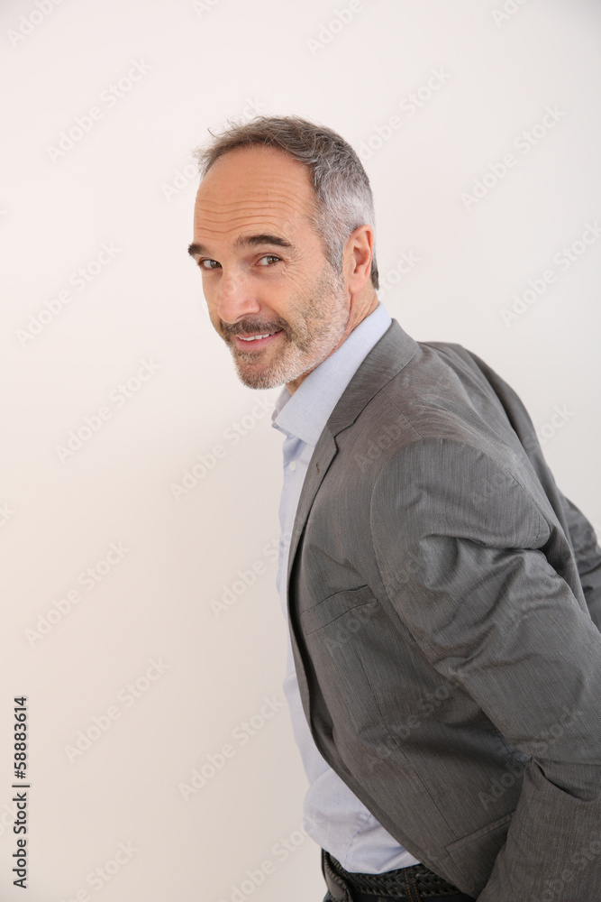 Senior businessman standing on white background Senior businessman standing on white background