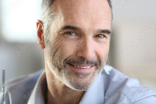 Closeup of handsome senior man with grey hair