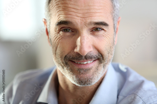 Closeup of handsome senior man with grey hair