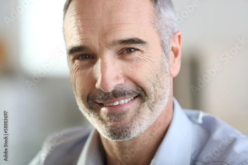 Closeup of handsome senior man with grey hair