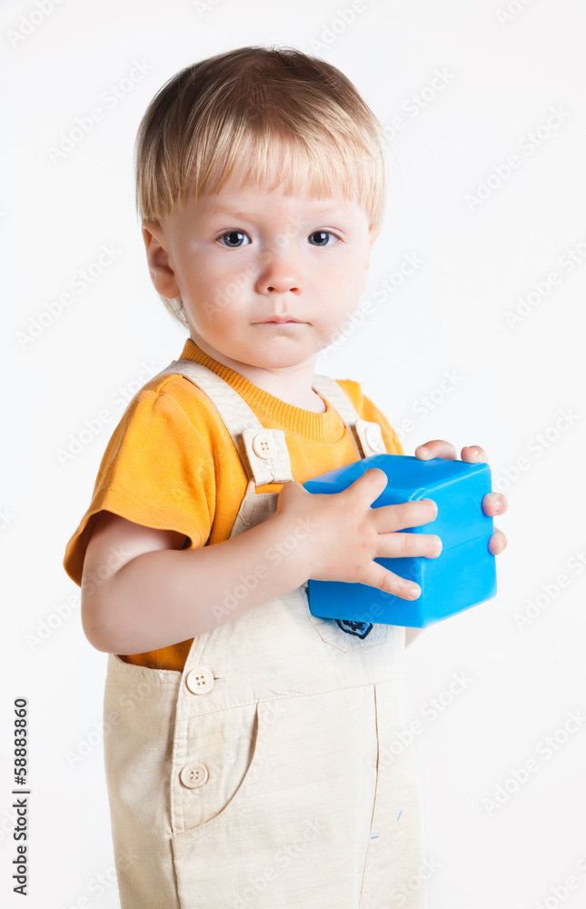 portrait of little boy with block portrait of little boy with block