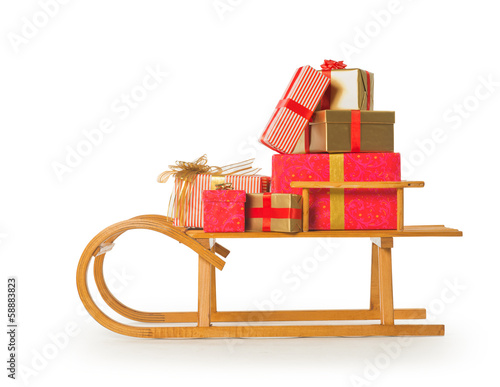 Sledge with Christmas presents on white background photo