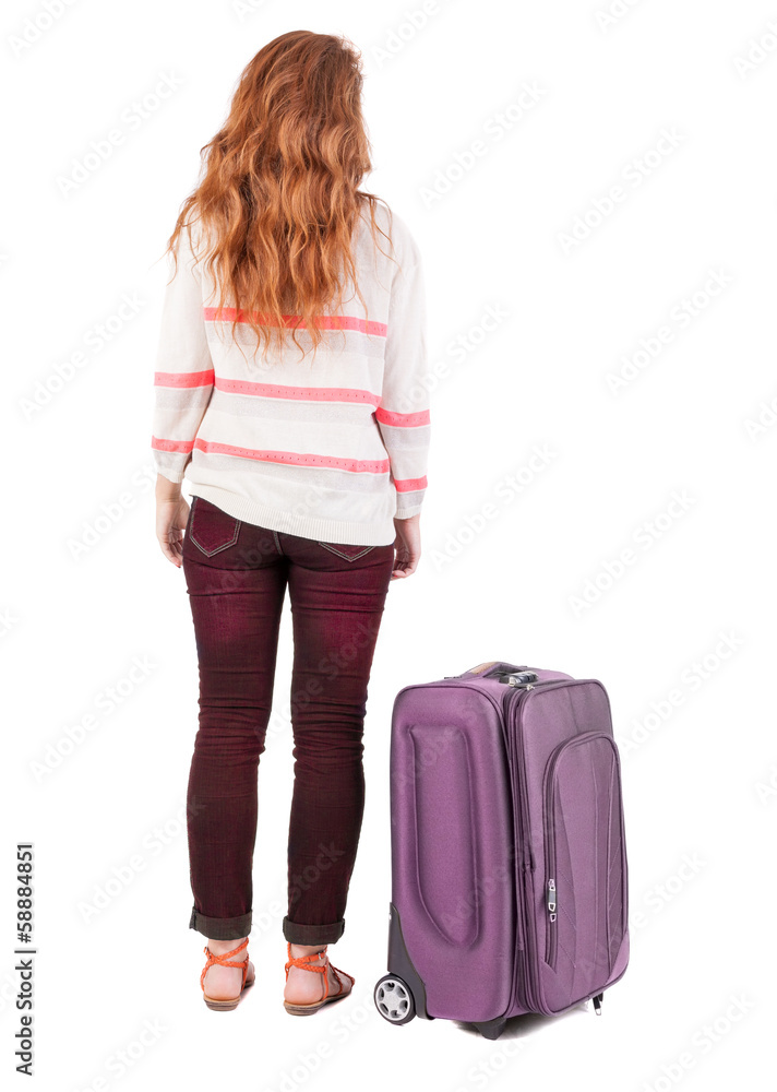 back view of walking woman with suitcase. back view of walking woman with suitcase.