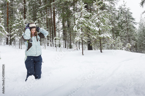 Woman outdoors at winter forest