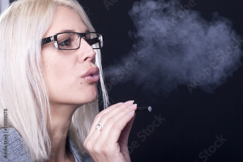 Young woman Smokin Electic Cigarette