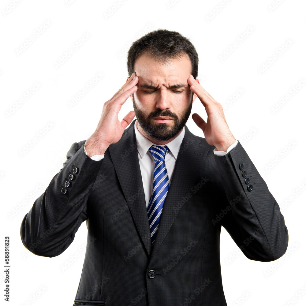 Young businessman with headache over white background Young businessman with headache over white background