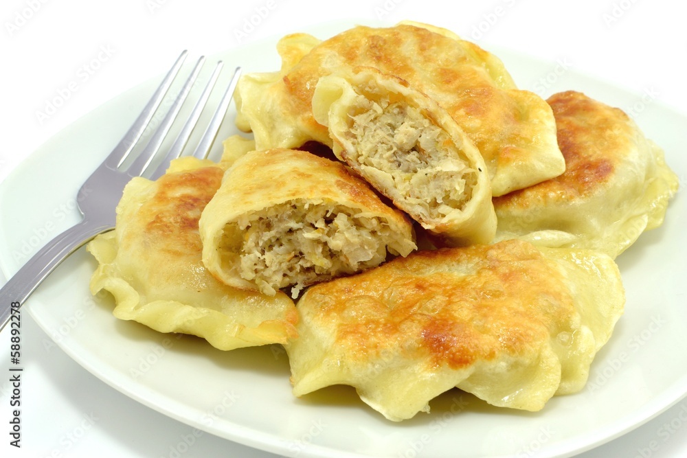 fried dumplings filled with meat and cabbage