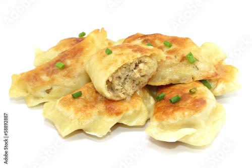 fried dumplings filled with meat and cabbage