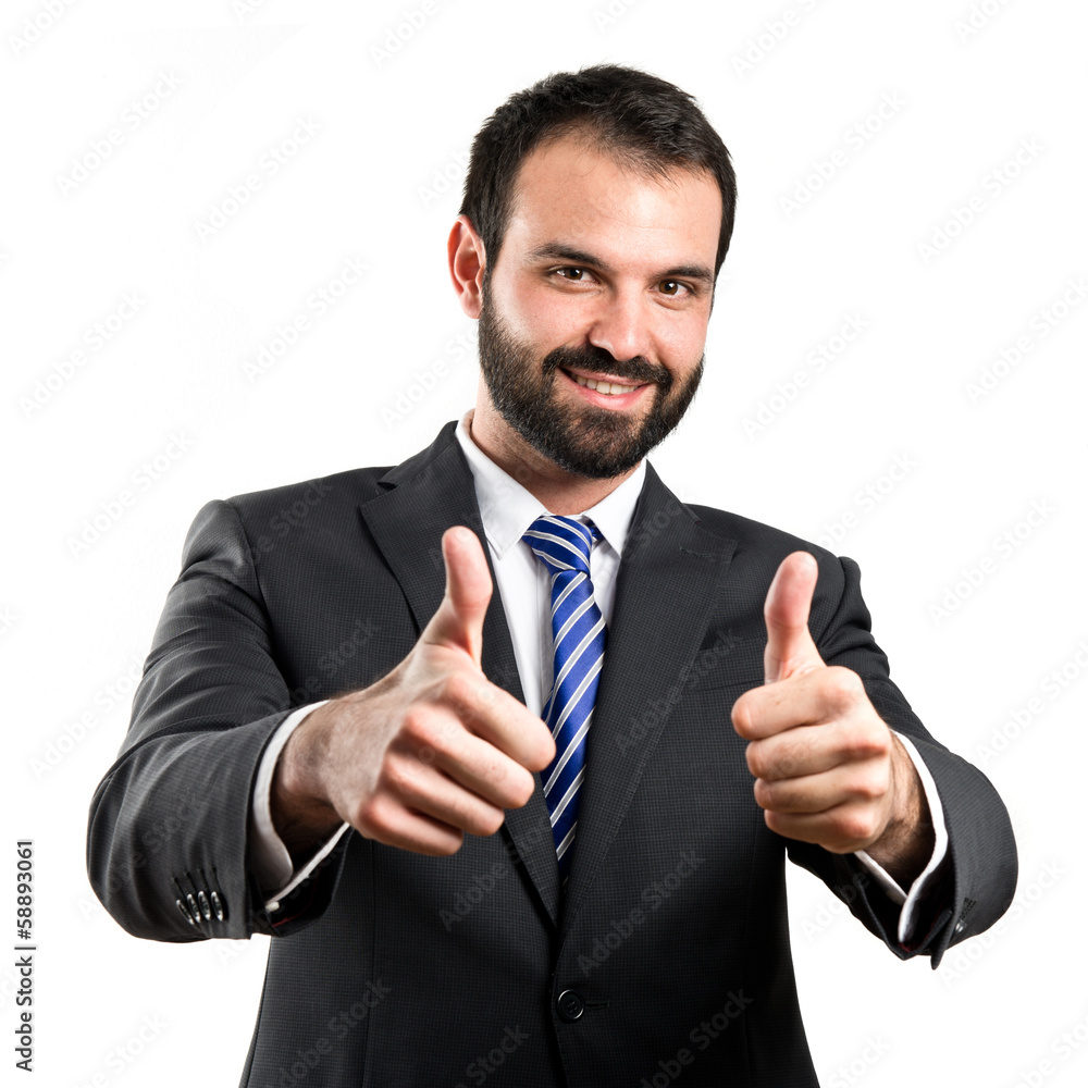 Young businessman getting OK over white background Young businessman getting OK over white background