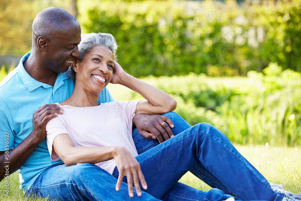 Romantic Mature Couple Sitting In Garden Romantic Mature Couple Sitting In Garden
