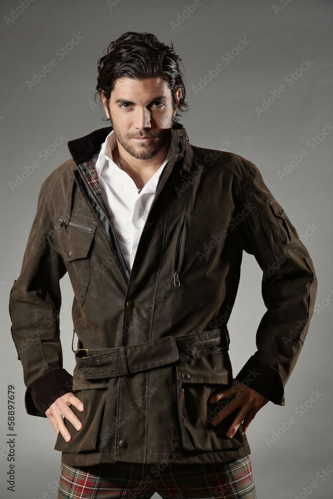 Handsome fashion model with tartan trousers Handsome fashion model with tartan trousers