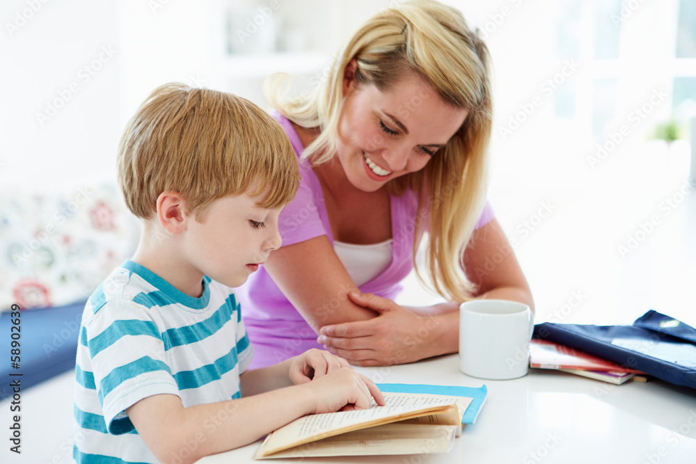 Mother Helping Son With Homework In Kitchen Mother Helping Son With Homework In Kitchen