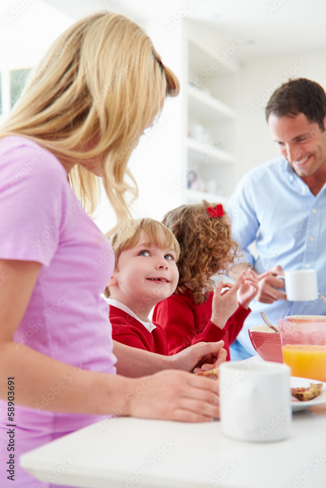 Family Having Breakfast In Kitchen Before School Family Having Breakfast In Kitchen Before School