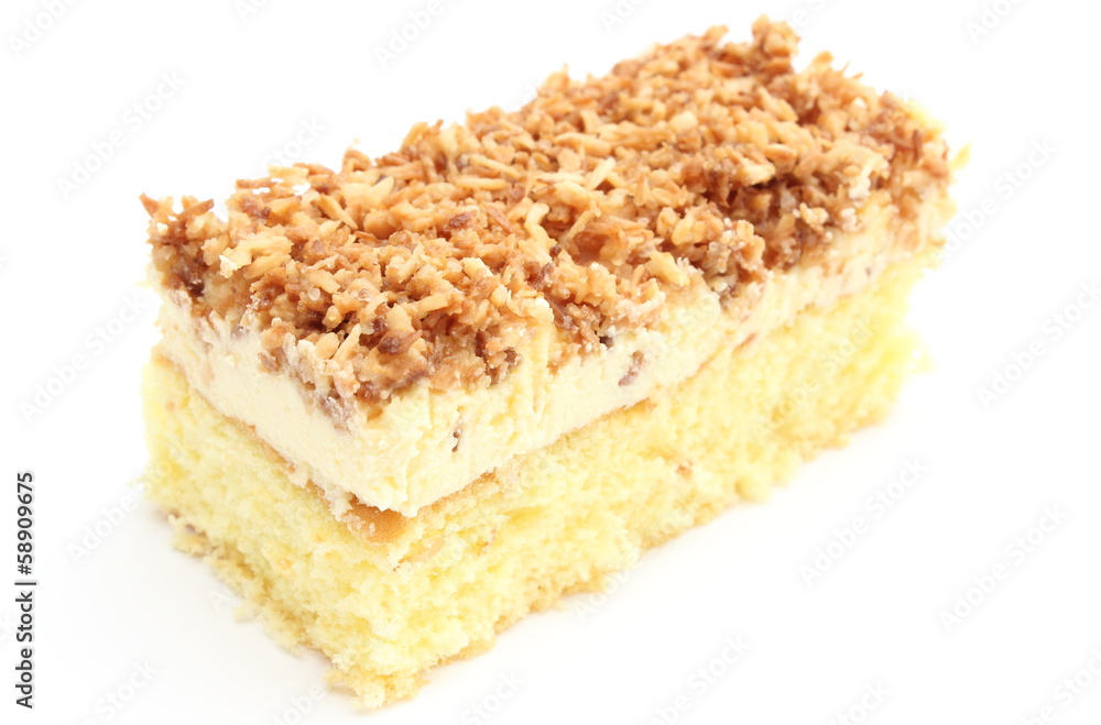 Sponge cake with cream and coconut. White background Sponge cake with cream and coconut. White background