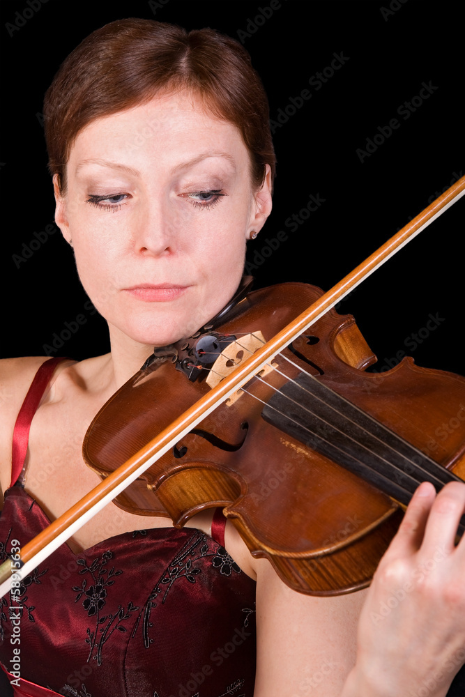 young woman plays the viola on black background young woman plays the viola on black background