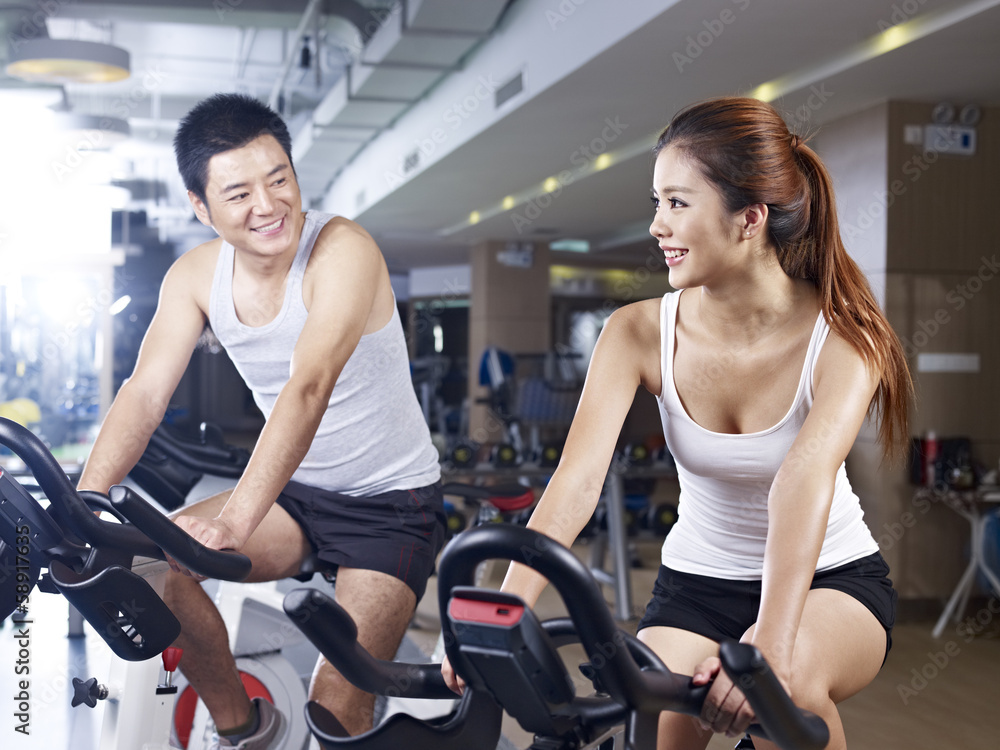 man and woman talking in gym man and woman talking in gym