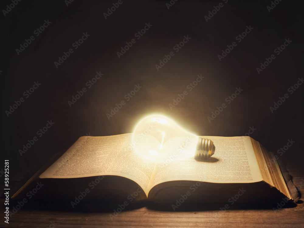 Fototapeta premium Bible with light bulb