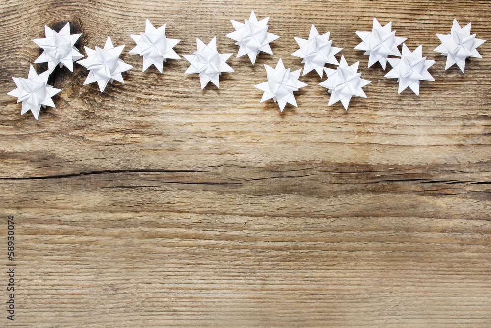 Paper stars on wooden rough background. Copy space Paper stars on wooden rough background. Copy space