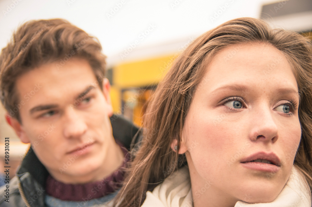 Couple during break up - Sad young woman Couple during break up - Sad young woman