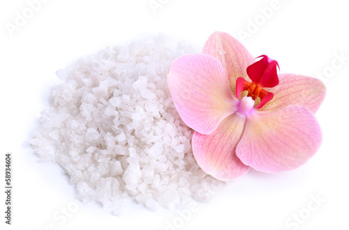 Beautiful blooming orchid flower  and heap of sea salt 