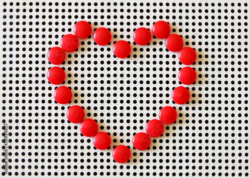 red heart made of red pins