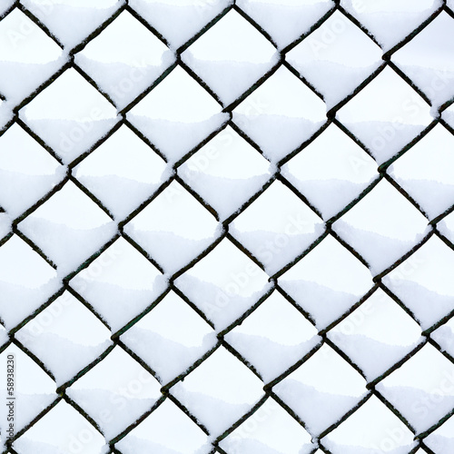 Chain link fence with snow