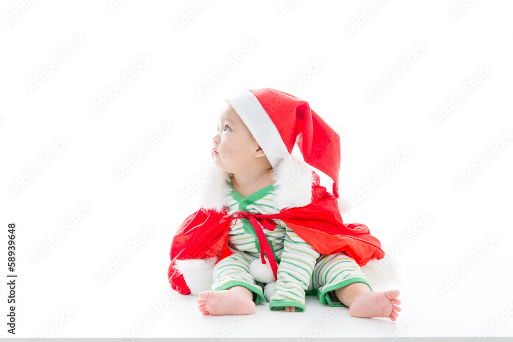 asian baby wearing santa costume on white background asian baby wearing santa costume on white background